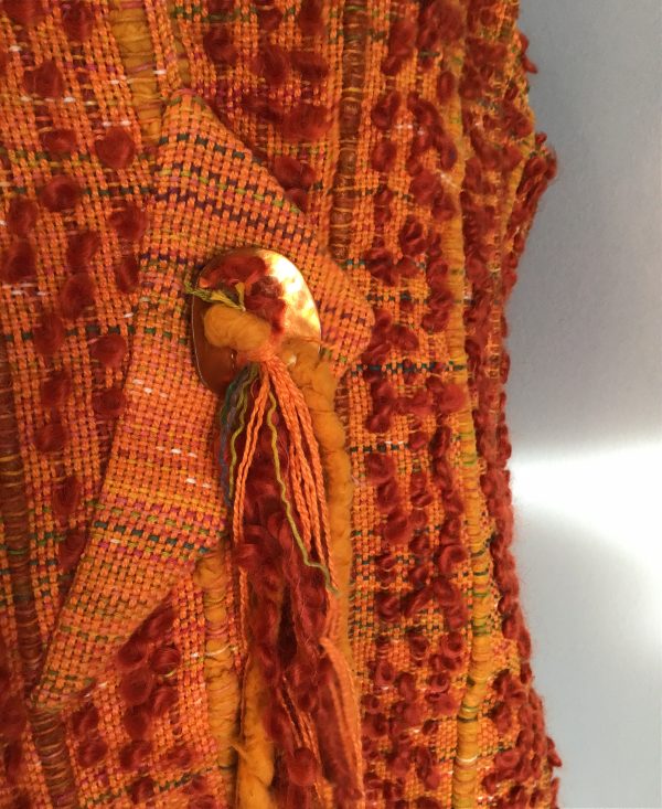 monochromatic orange vest